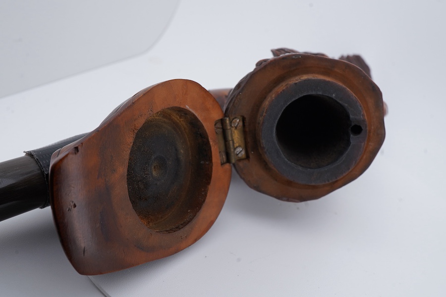 An American Civil War briar pipe in the form of the head of a bearded soldier, with horn mouthpiece, 23cm long